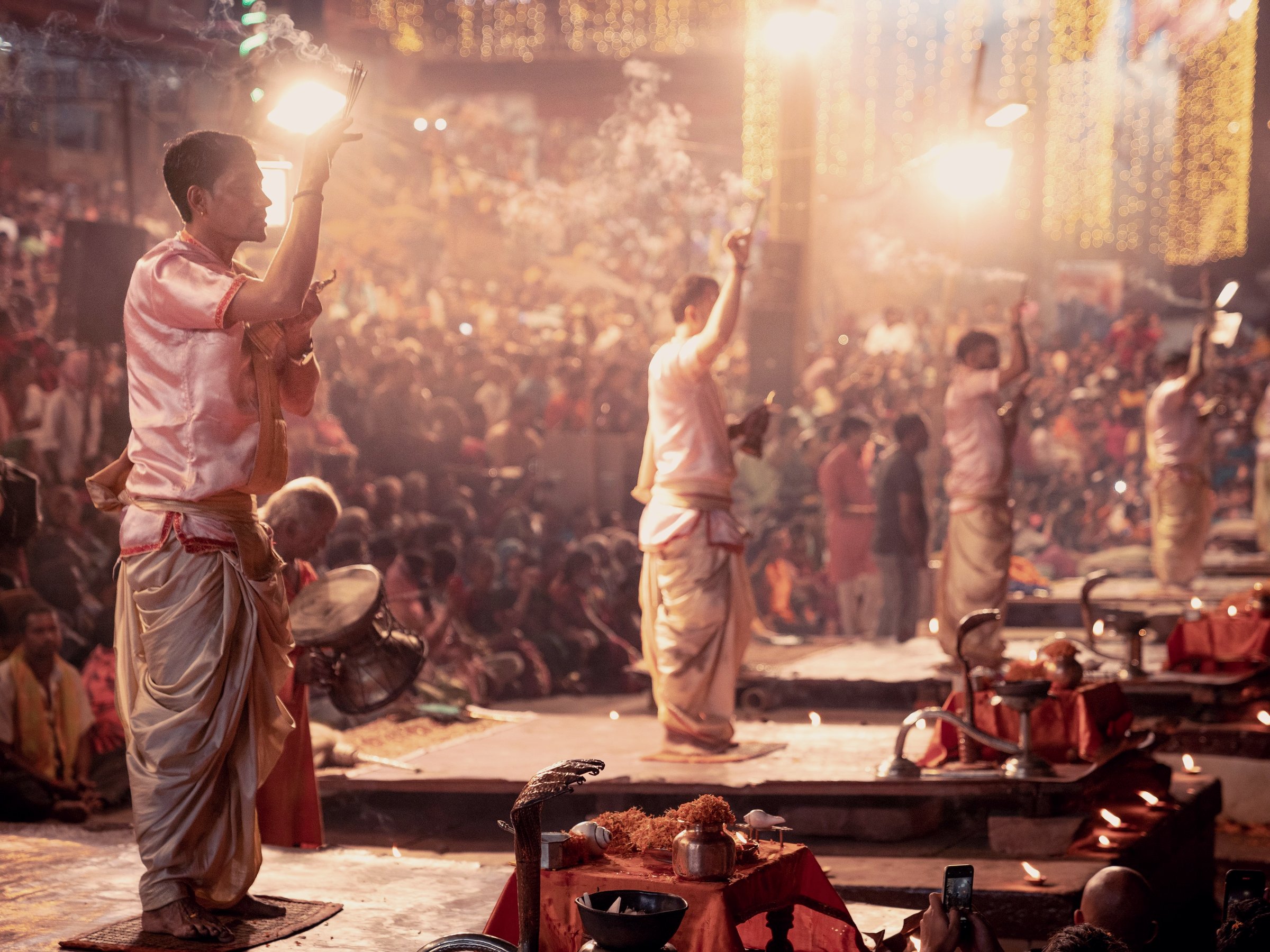 Priests performing the evening aarti at a river ghat